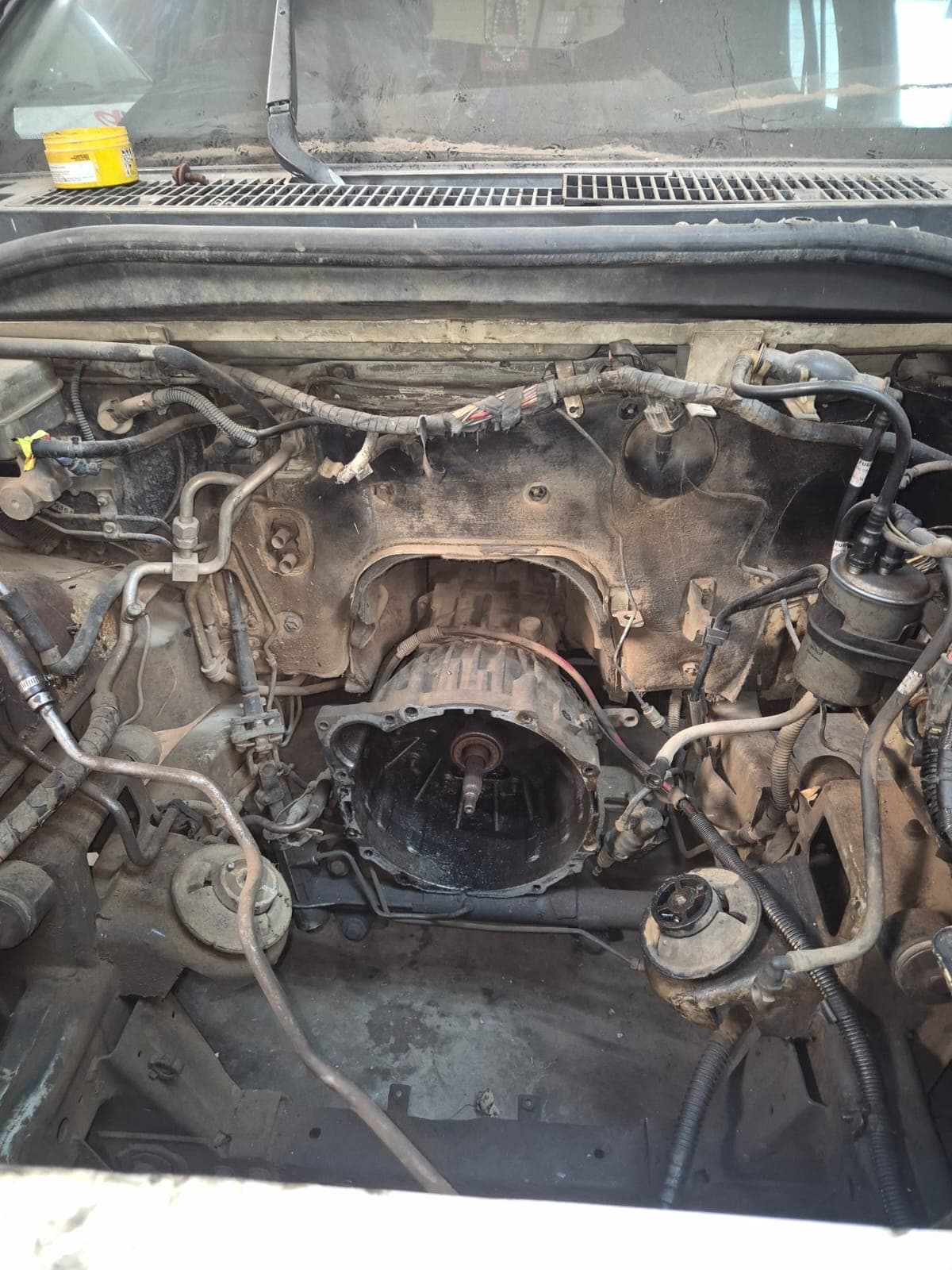 Workshop mechanic servicing a car